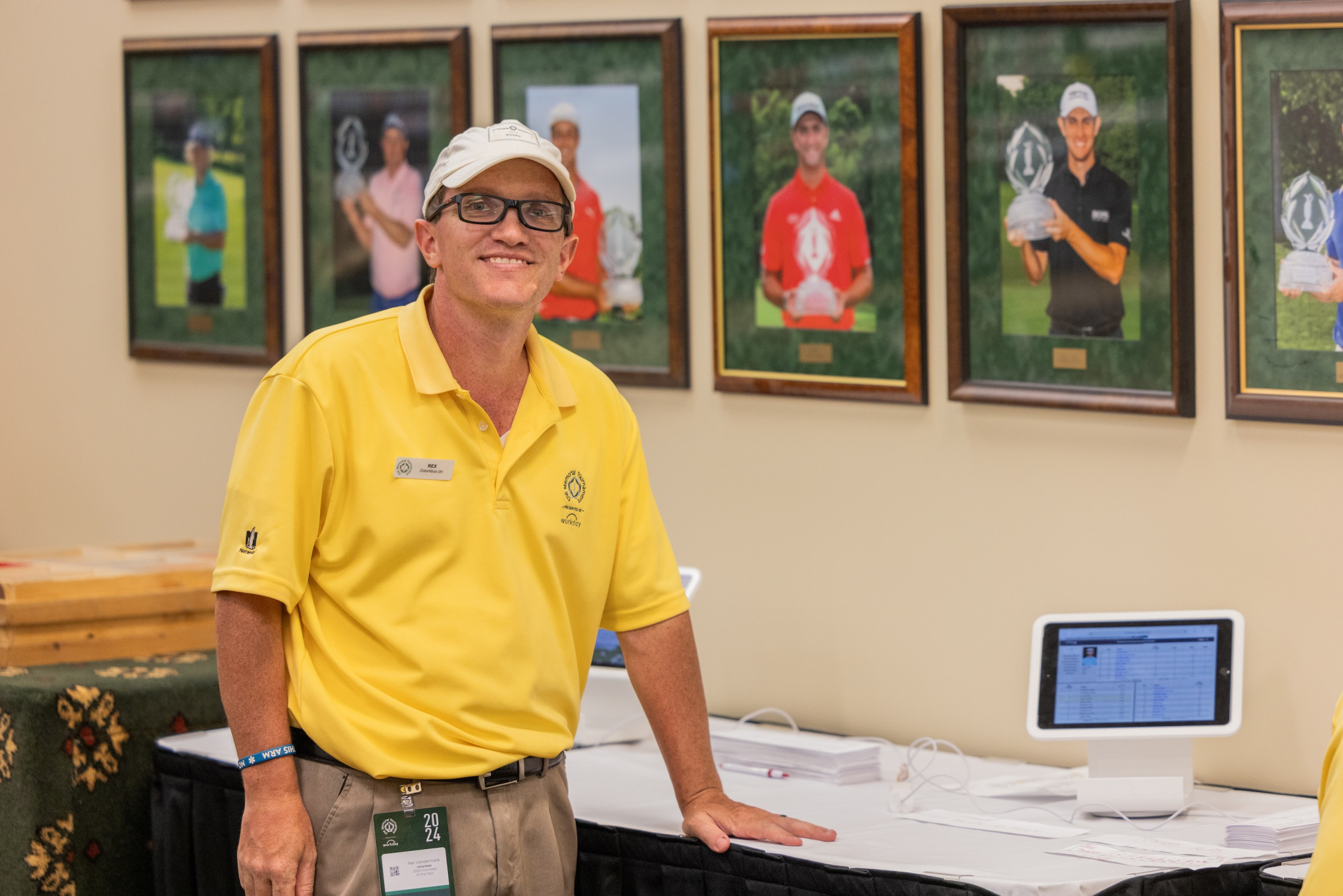 Volunteer discussing tournament reminders with spectators